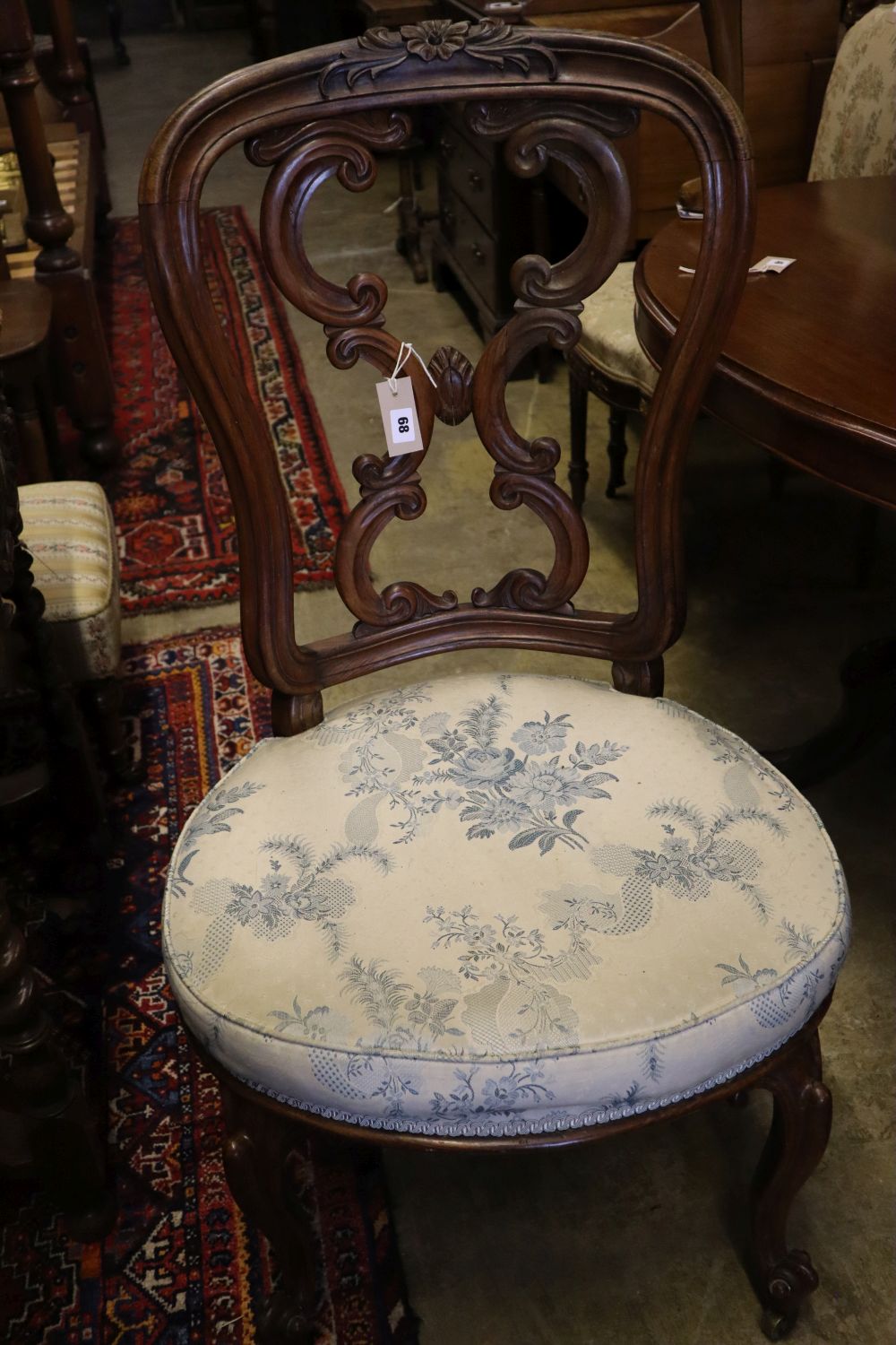 An Art Nouveau style Edwardian inlaid mahogany salon chair and an early Victorian carved rosewood salon chair (2)